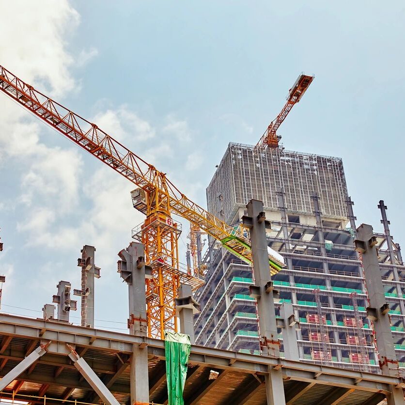 Skyscraper Building under construction in summer day. Skyscraper Building under construction in summer day.